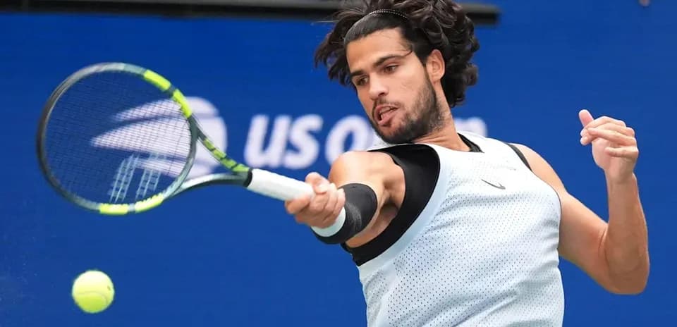 Player hitting a forehand shot during tennis match