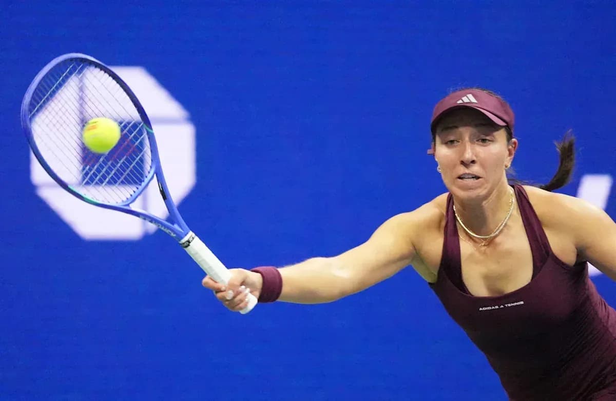 Tennis player reaching for a ball with racket