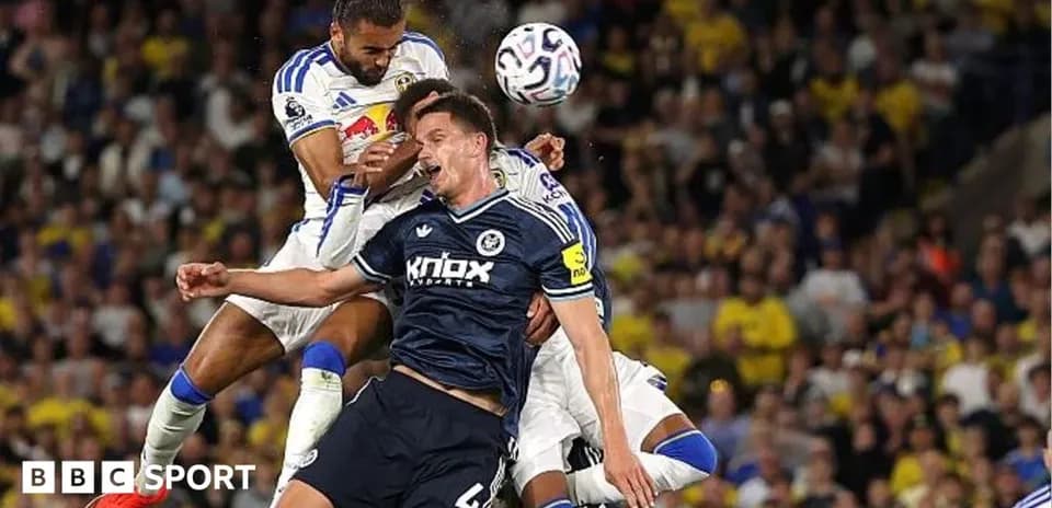 Players challenging for the ball during match action