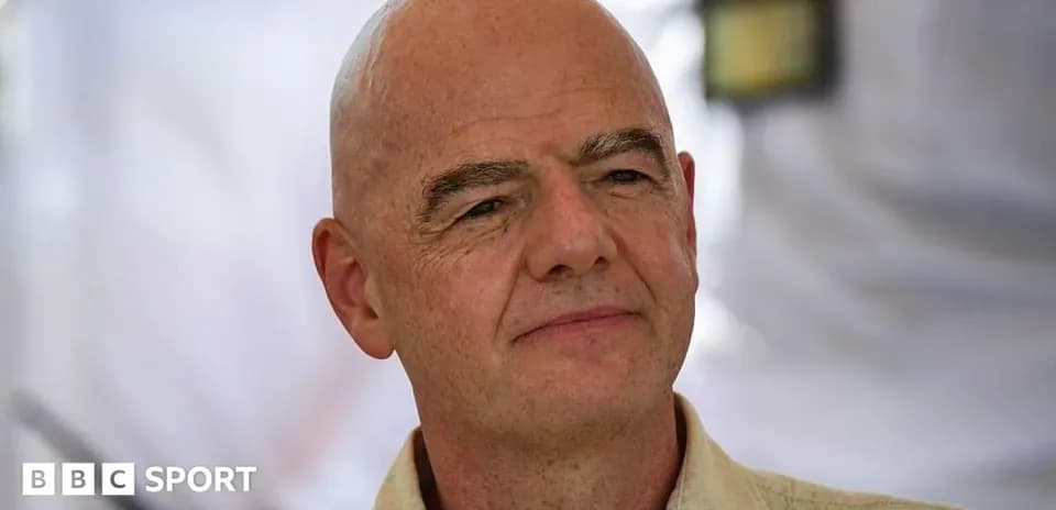 Man with bald head during press event