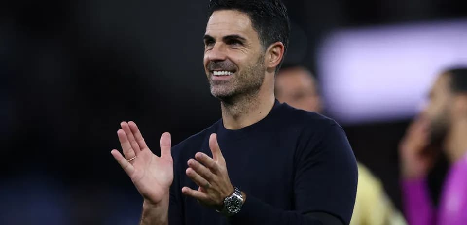 Manager applauding during a match celebration