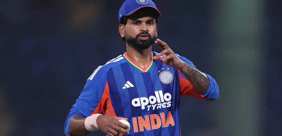 Cricketer gesturing while holding a cricket ball