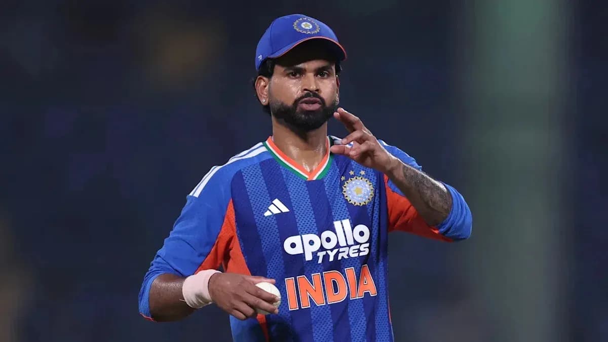 Cricketer gesturing while holding a cricket ball