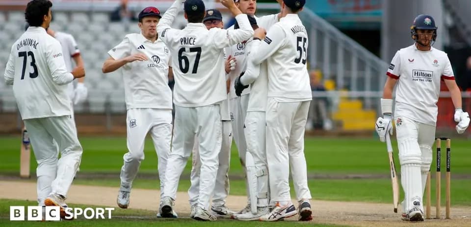 Players celebrating after taking a wicket during cricket match