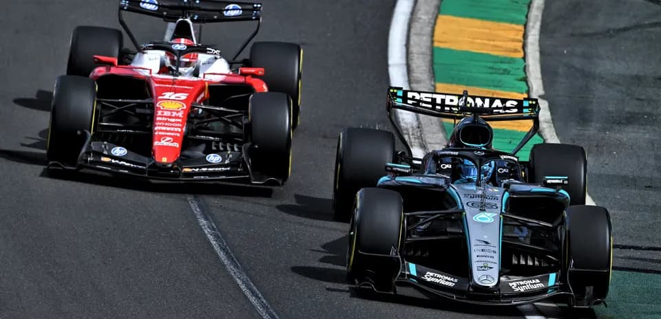 Two Formula 1 cars racing on track