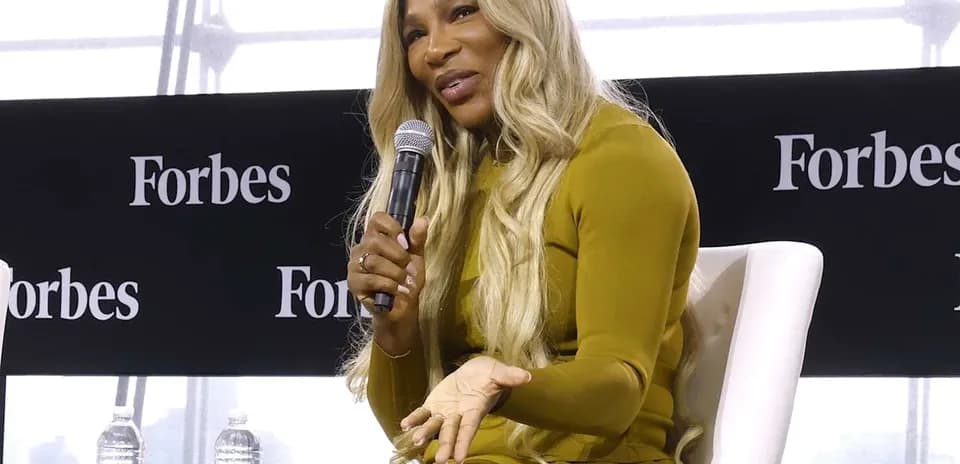 Speaker discussing at Forbes event on stage