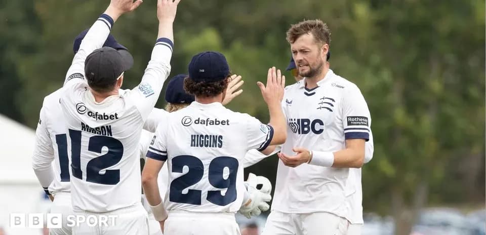 Middlesex players celebrating a wicket on field