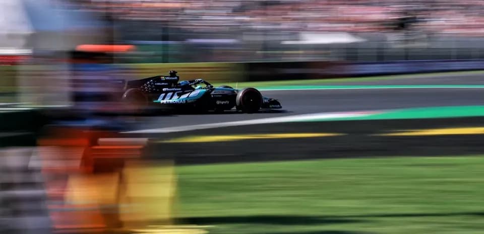 Formula 1 car racing around the track