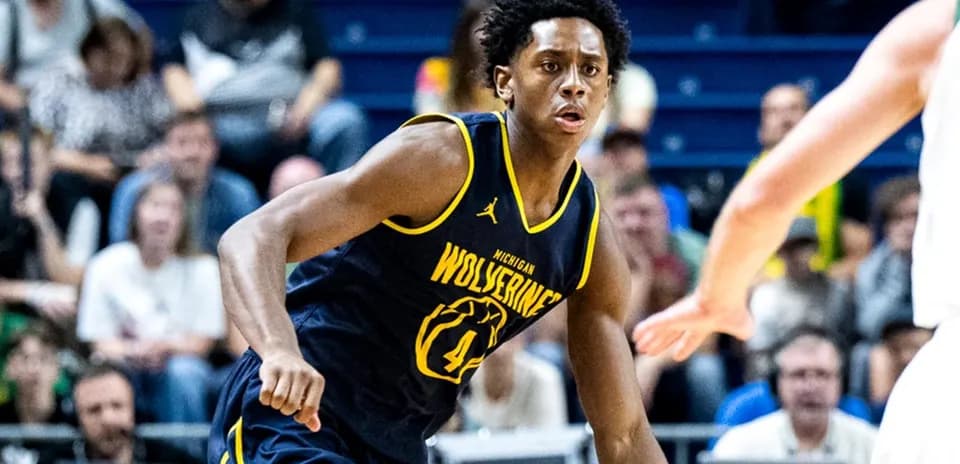 Player from Michigan Wolverines dribbling during game