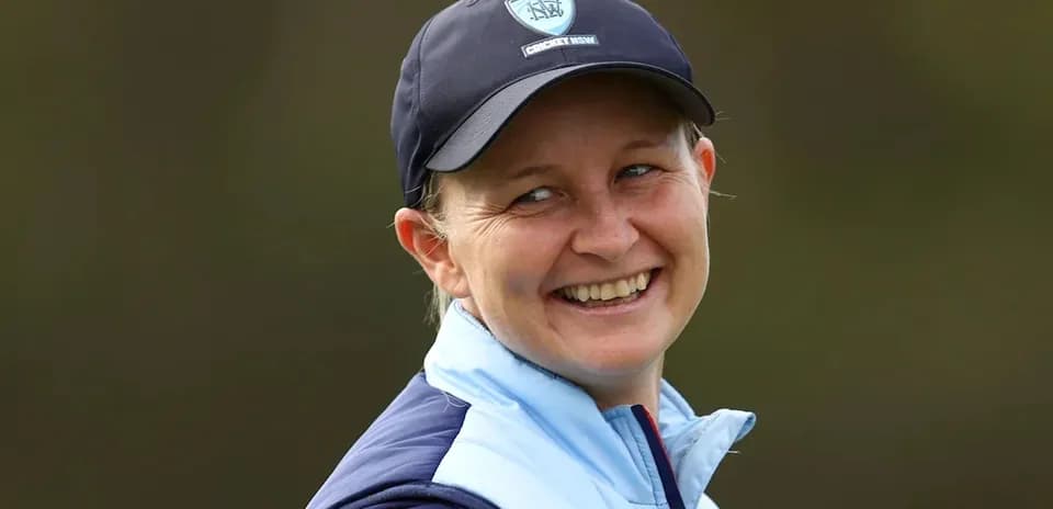Cricketer smiling during a practice session