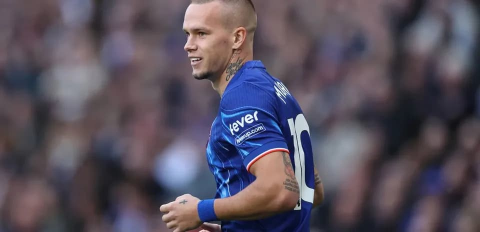 Player in blue jersey during football match