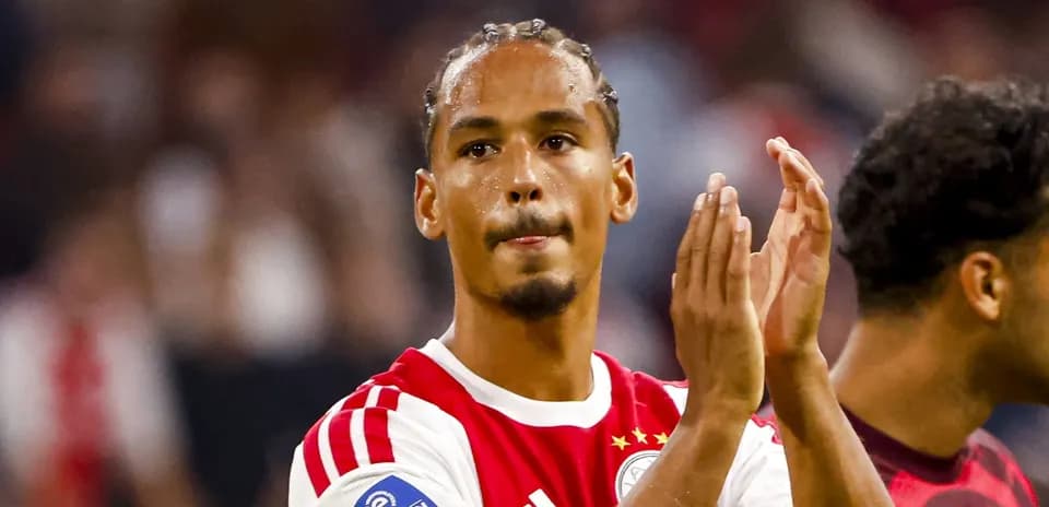 Player applauding fans after a match
