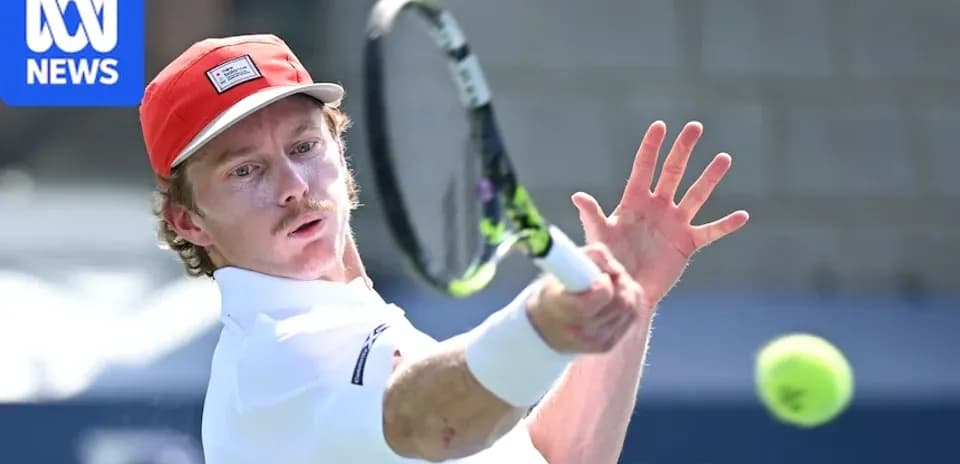 Player hitting a tennis ball during a match