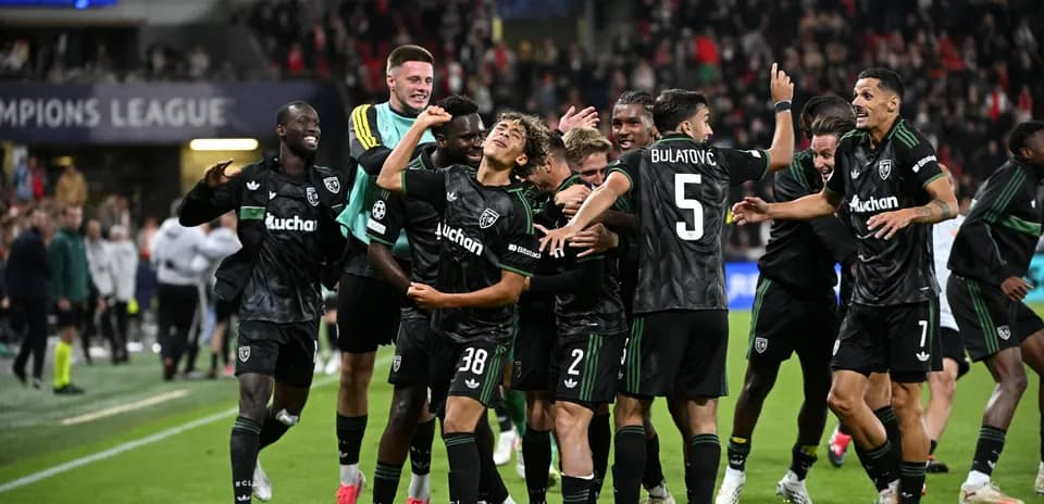 Players celebrating after a Champions League match victory