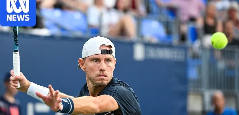 Tennis player hitting a forehand shot during match