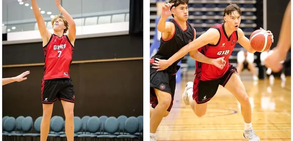 Two basketball players in action during practice