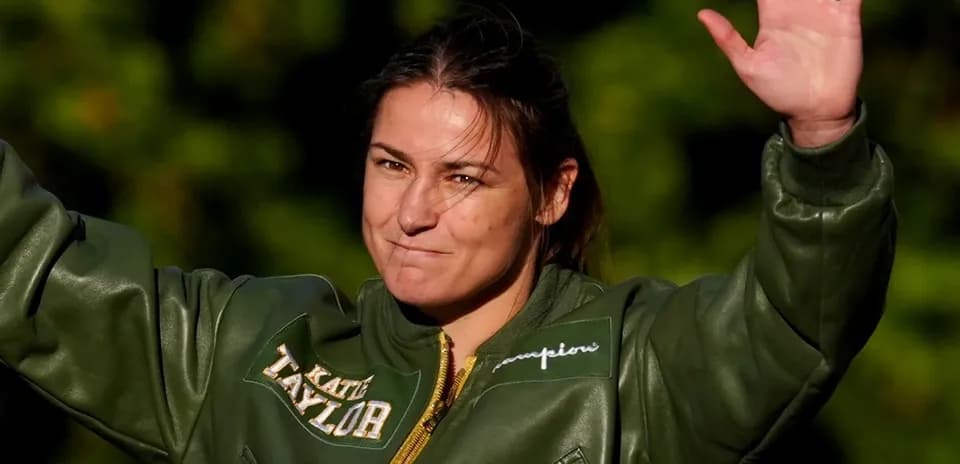 Katie Taylor waving during public appearance outdoors