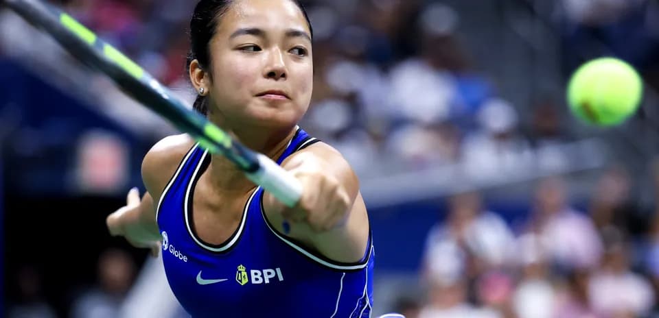 Tennis player hitting a ball during a match