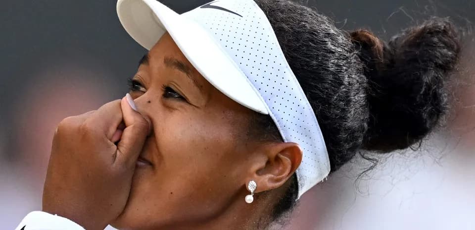 Naomi Osaka celebrating after a match victory