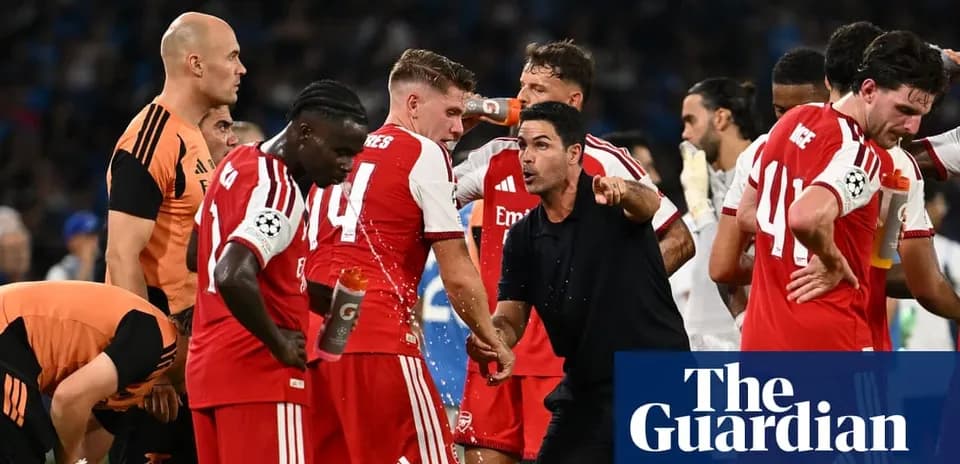 Arsenal players gather around coach during match break