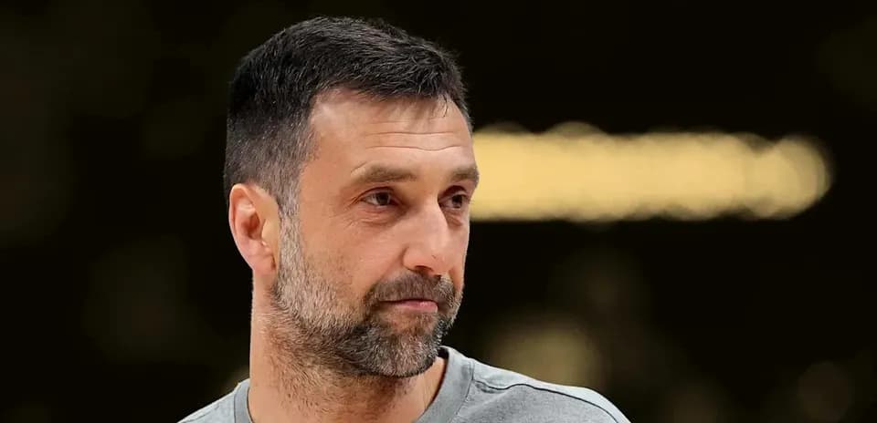 Coach observing practice session in gym