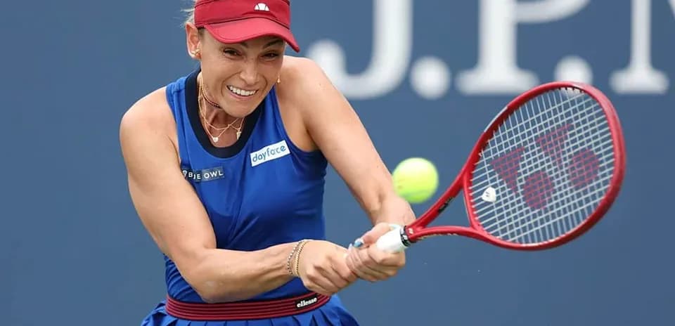 Tennis player hitting a forehand shot during match