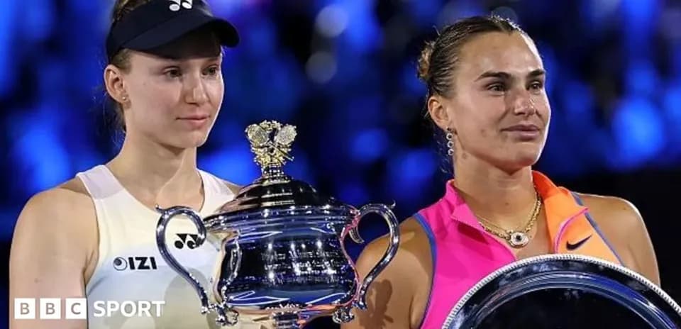 Two tennis players holding trophies after a match