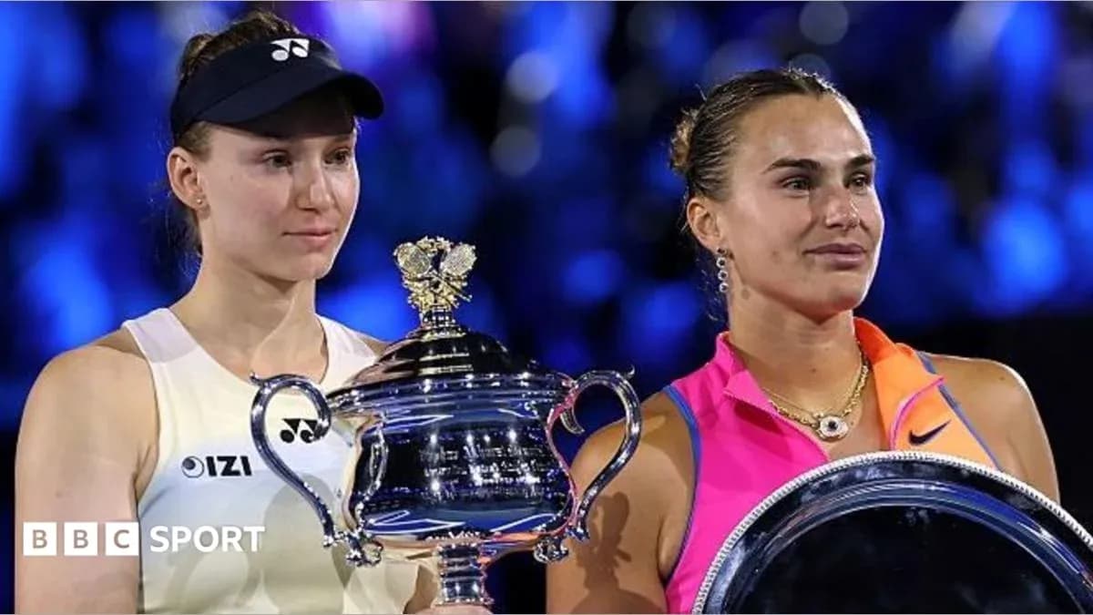 Two tennis players holding trophies after a match