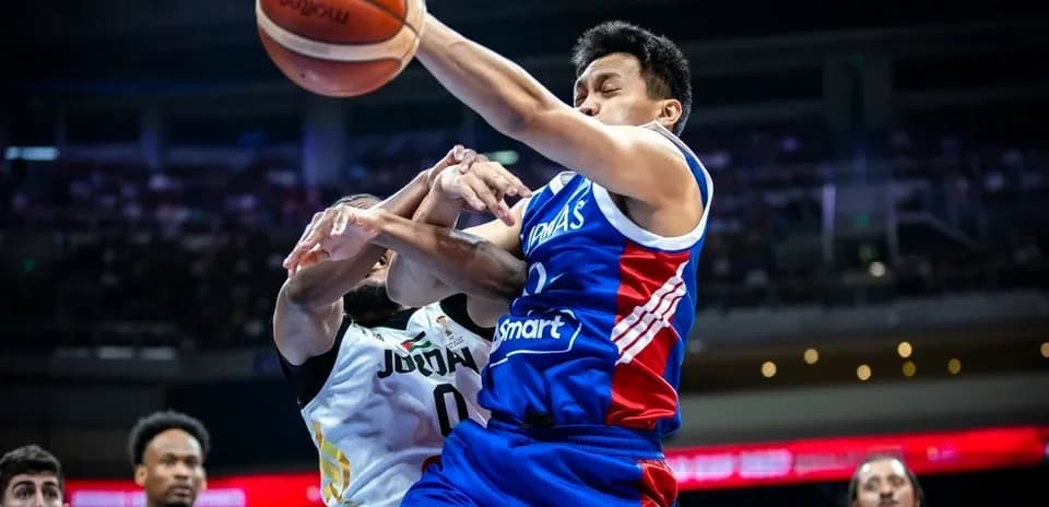 Player in blue jersey attempting to shoot basketball