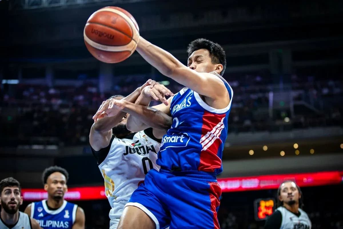 Player in blue jersey attempting to shoot basketball