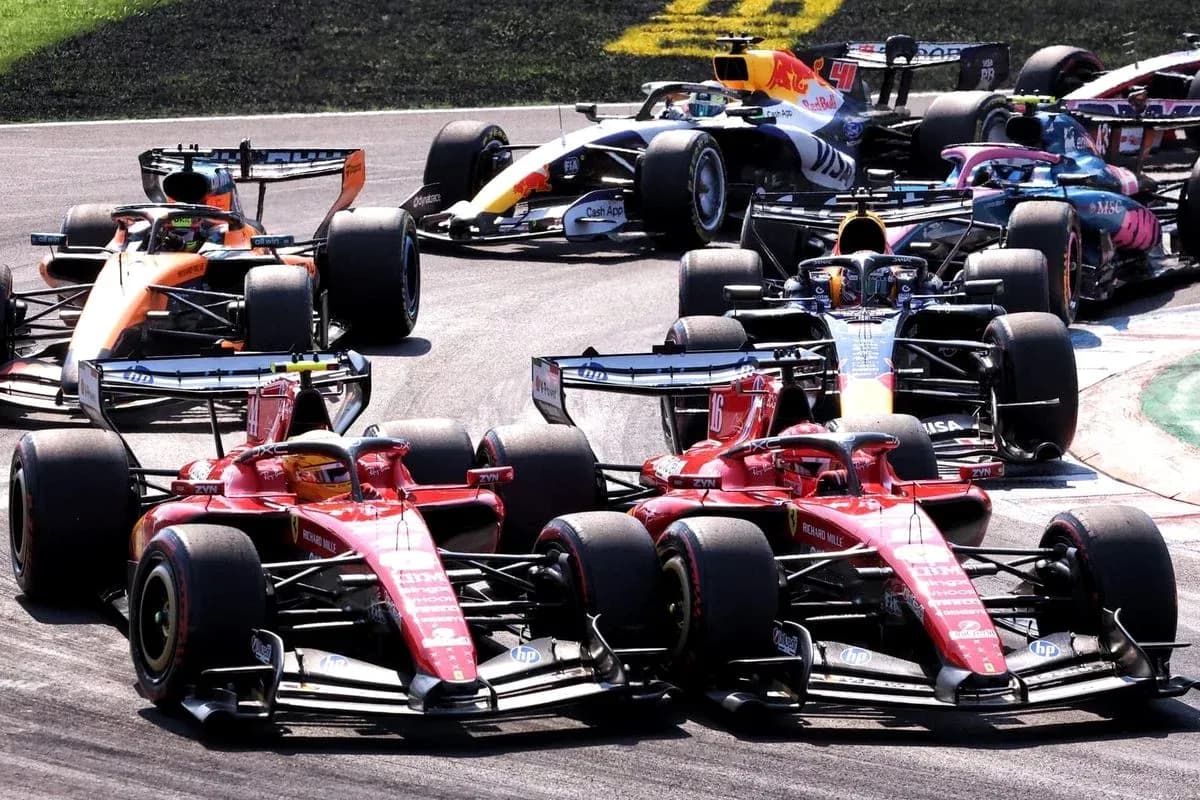 Multiple Formula 1 cars racing closely on track