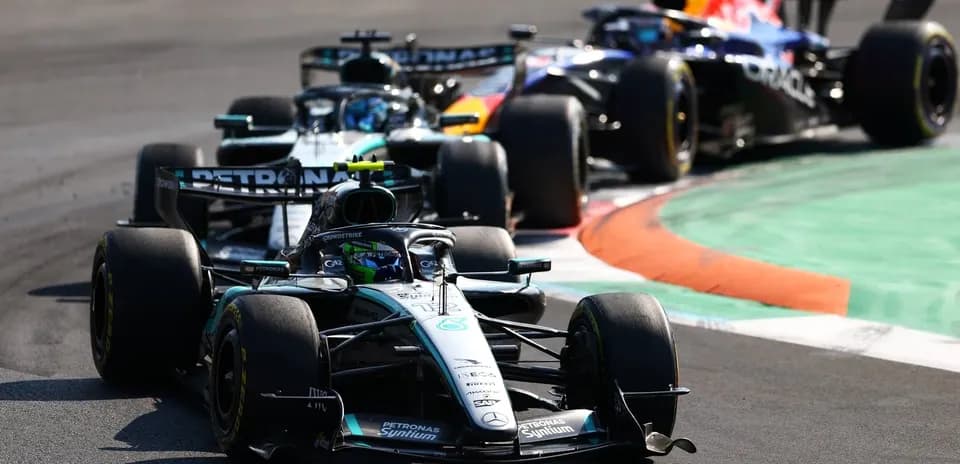 Mercedes and Red Bull cars racing on track