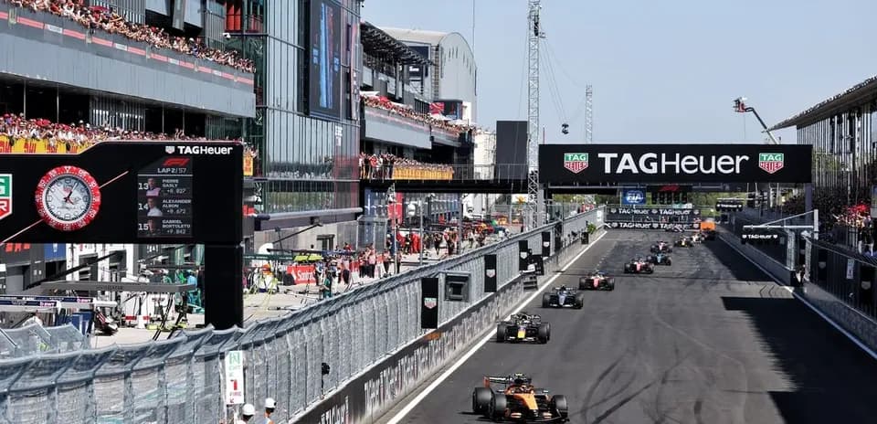 Formula 1 cars racing at circuit during event