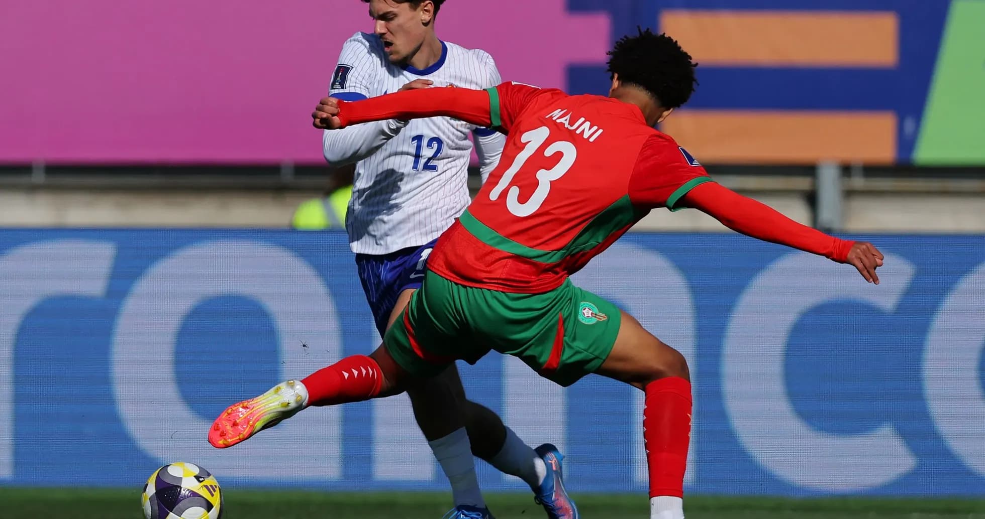 Player tackling opponent during football match