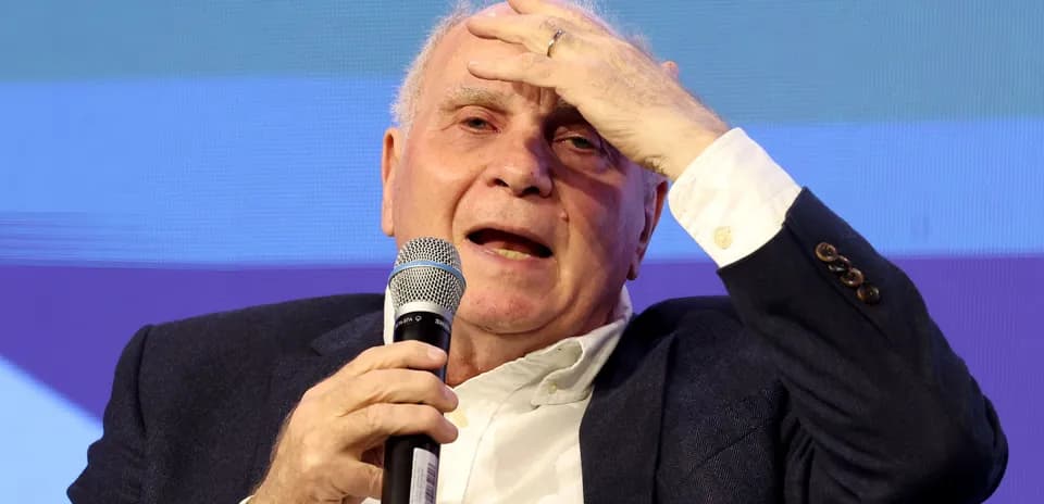 Speaker holding microphone during public discussion event