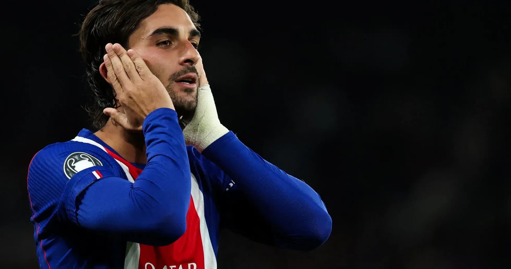 Player reacting during a match wearing blue jersey
