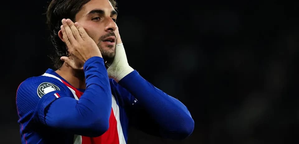 Player reacting during a match wearing blue jersey