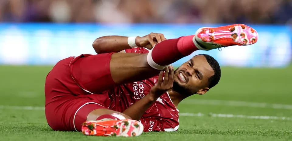 Player lying on field holding injured leg