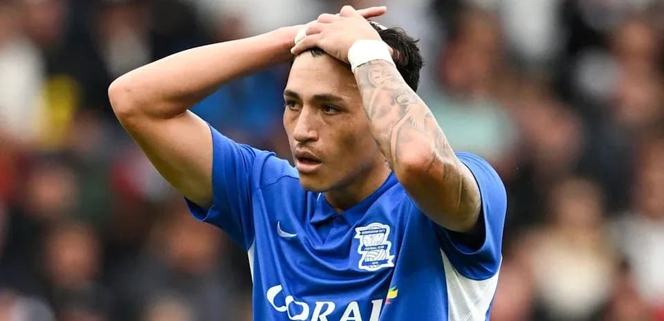 Birmingham City player with hands on head during match