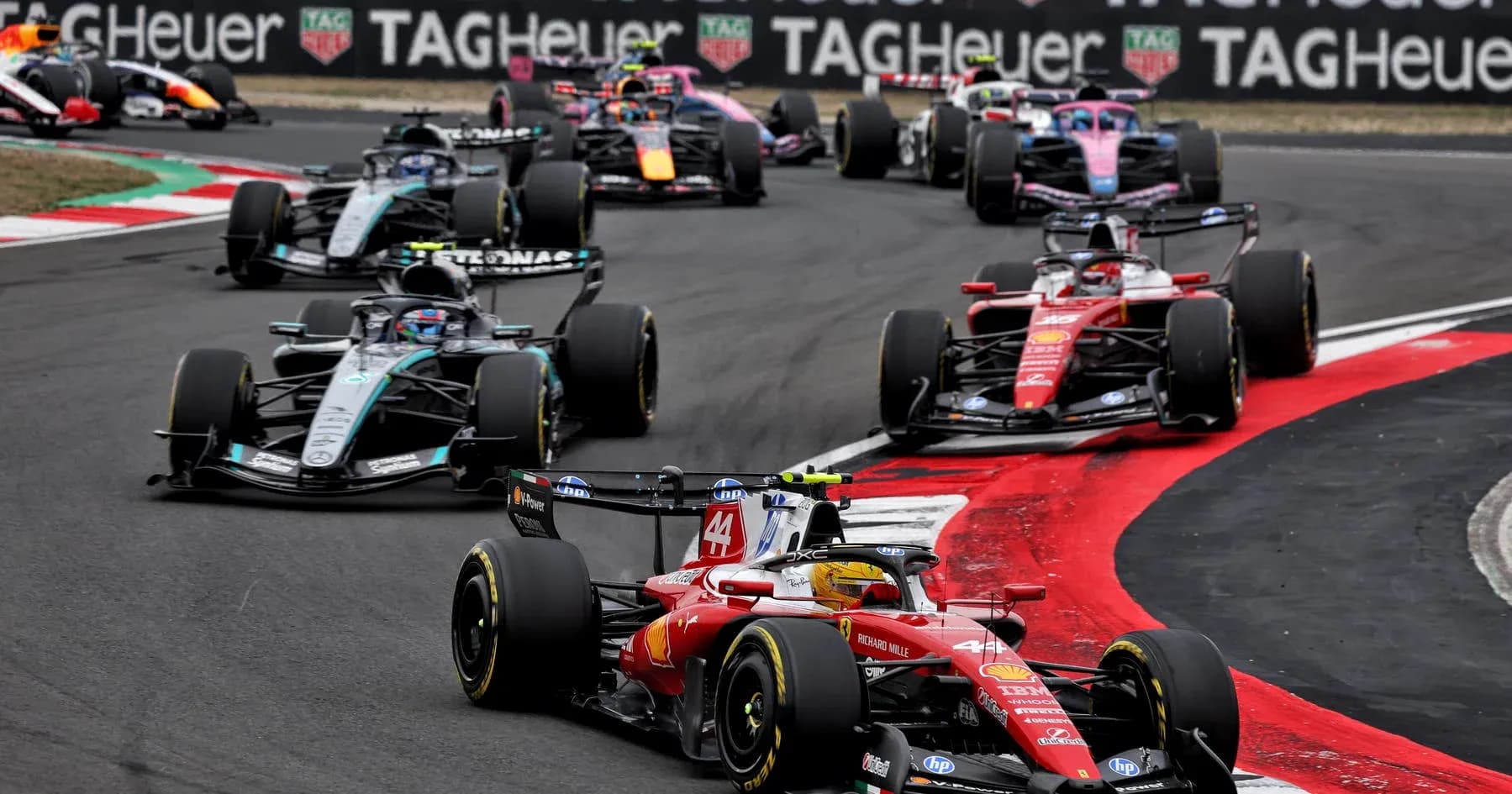Formula 1 cars racing on track during event