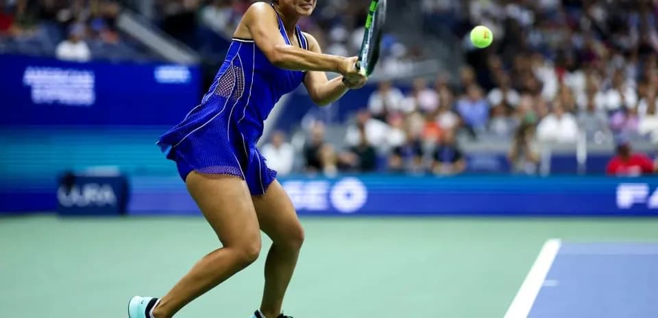 Player hitting a tennis ball during match