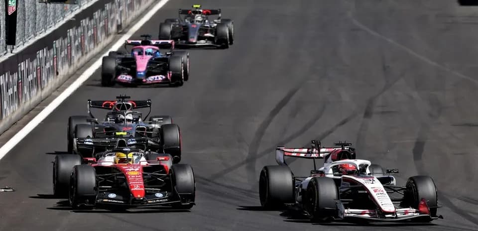 Multiple Formula 1 cars racing on track