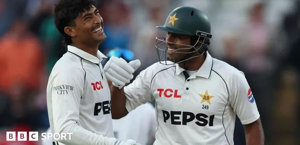 Two cricketers celebrating during a match