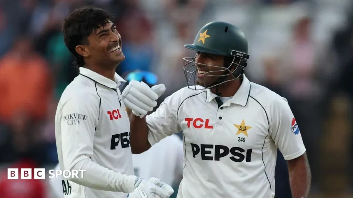 Two cricketers celebrating during a match