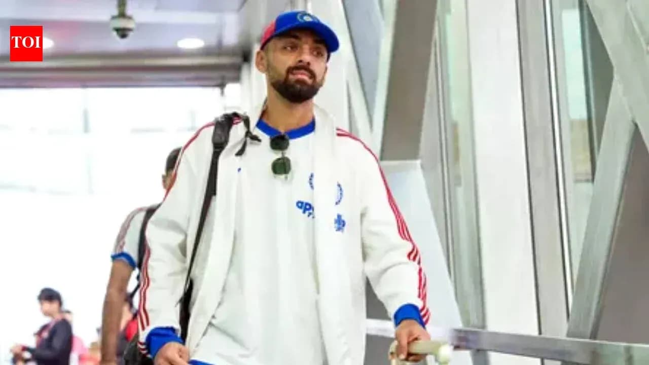 Player walking through airport terminal with luggage