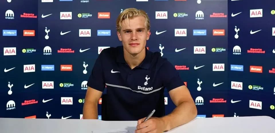 Player signing contract at Tottenham Hotspur press conference