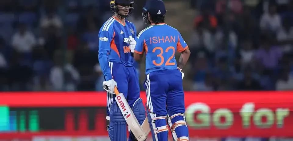 Two Indian cricketers discussing on the pitch