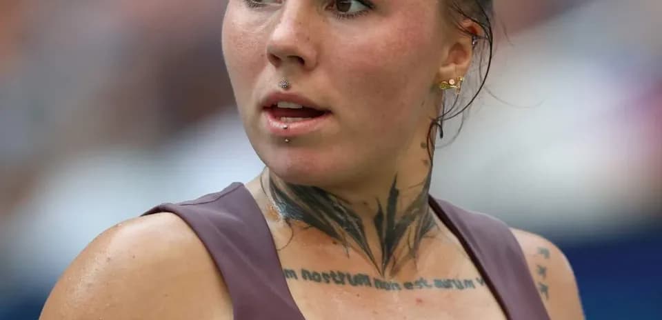 Athlete with tattoos during a match close-up