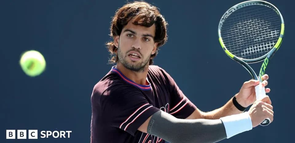 Player preparing to hit a tennis ball during match