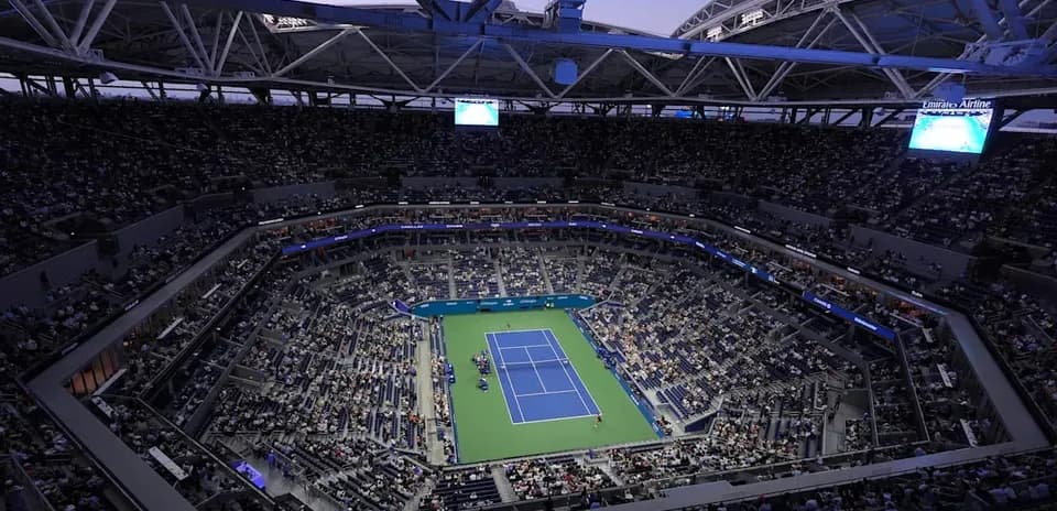 View of a tennis match at a packed stadium
